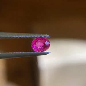 Small pinkish red Burma ruby