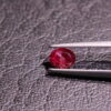 Oval red beryl with certificate