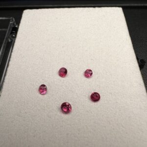 Set of round red beryls